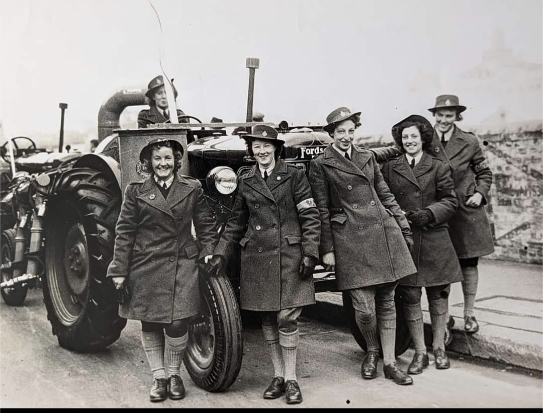 Womens Land Army photo with tractor